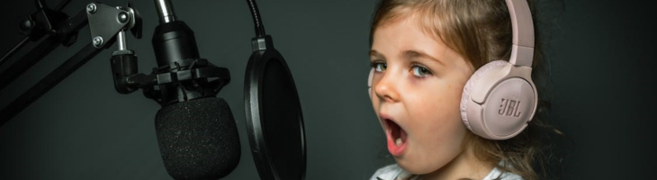 kid using microphone and headphones