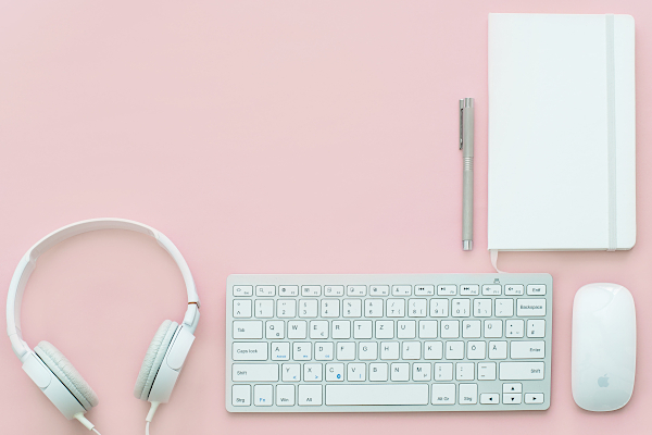 Keyboard, notebook and headphones