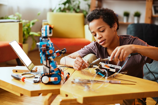 a boy making a robot