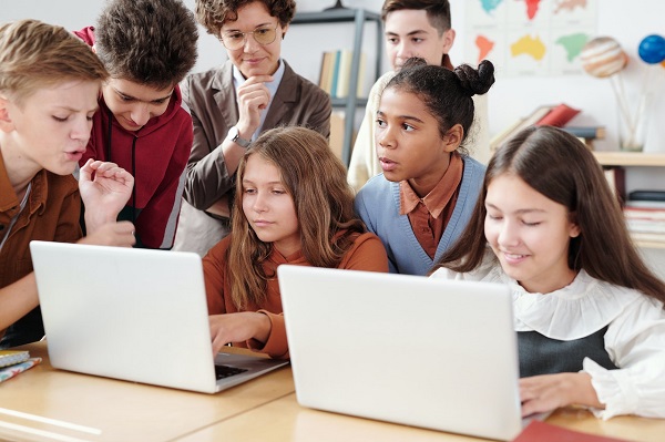 Pupils using laptops together
