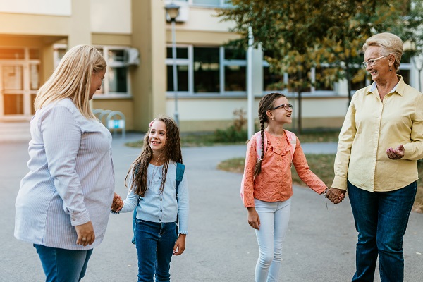 Parents taking children to school