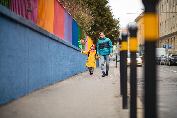 Parent and child walking to school