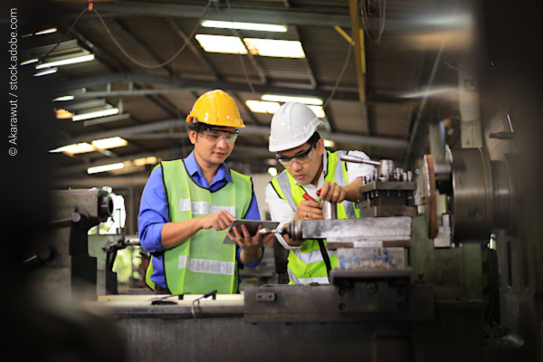 Two vocational students working in a workshop