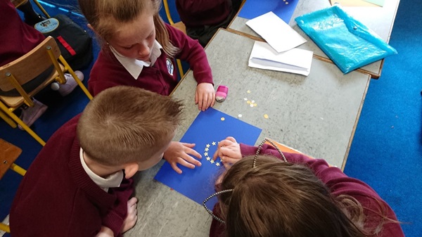 Three pupils making an EU flag
