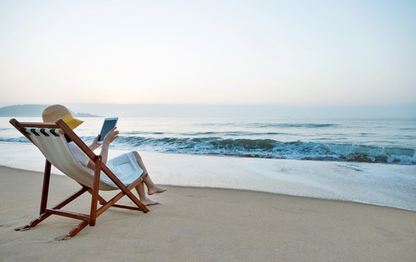 Woman reading in a beach chair