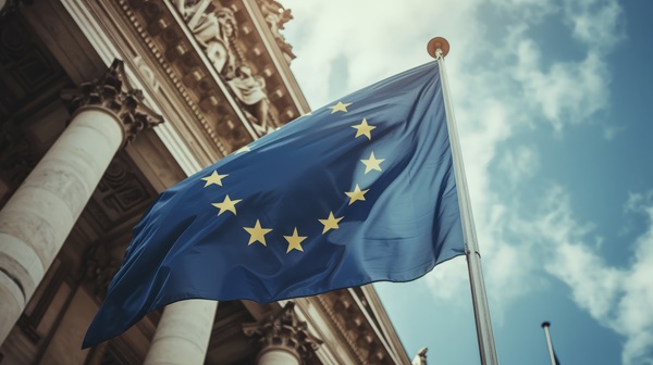 EU flag flying in front of a historic buliding