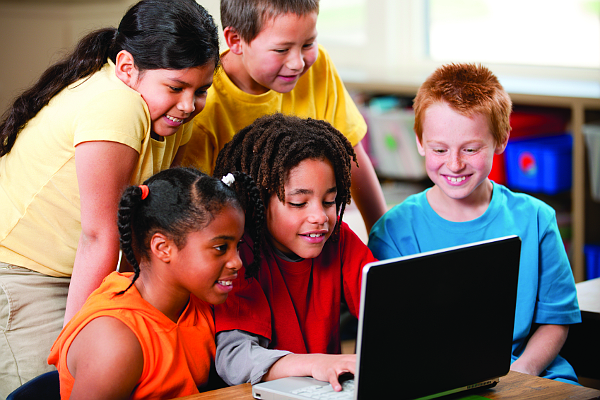 Pupils using a laptop together