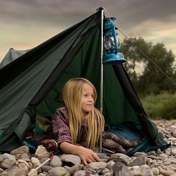 a girl in a camping tent