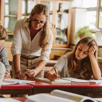Secondary teacher with students