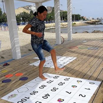 A participant on our Smart Teachers Play More Outdoors course enjoying an active learning activity by the seaside.