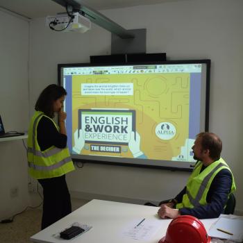Teacher and trainer discussing a case study using realia and class discussions to collaboratively come up with solutions