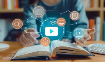 Illustration of a book and digital symbols for digital learning and multimedia integration 