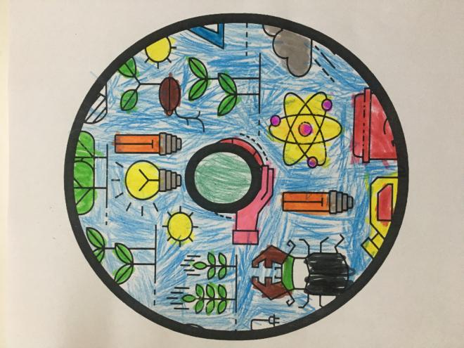 Children color the letter for the slogan of the project
