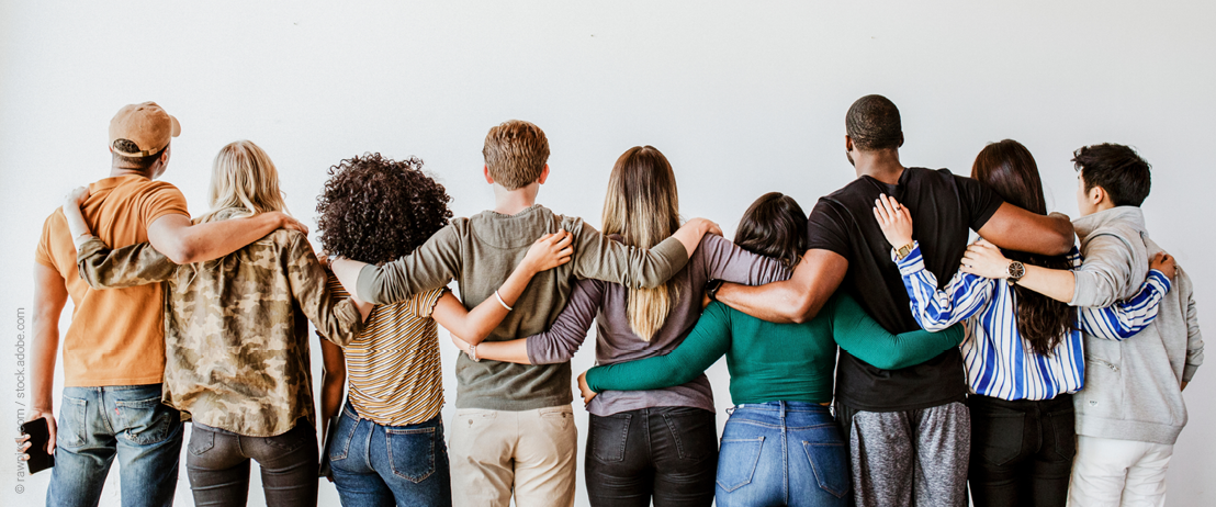 Photo of people with arms around each other