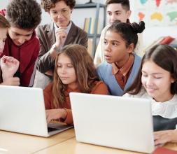 Pupils using laptops together
