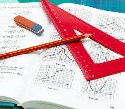 School supplies and textbooks on mathematics close up