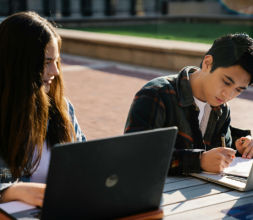 Two students with laptop
