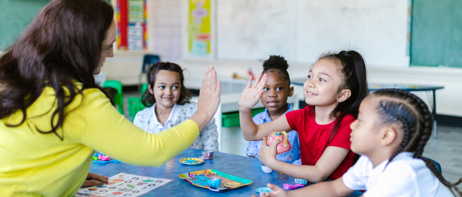 kids high five teacher
