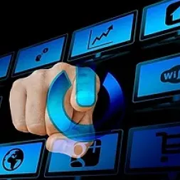 A finger pushing an “on” button on a projected screen