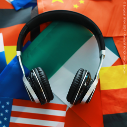 headphones laying on top of flags