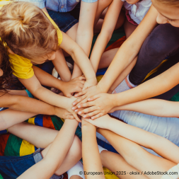 kids stacking hands