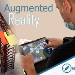 The image shows a teacher testing the augmented reality applications.