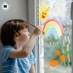 child painting on a window