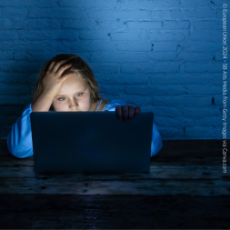 young girl looking at the laptop screen