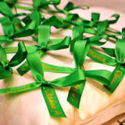 Green ribbons with names that our graduates receive