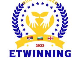 Blue and yellow are main colours of this logo. On the top yellow letters Our heroines, on the bottom blue letters Etwinning, above 2023, and flags of countries participants