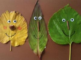 Stick figures made of autumn leaves that smile at all the children 