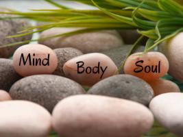 relaxing picture showing natural elements and the 3 areas of wellbeing (namely mind, body and soul)