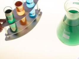 Erlenmeyer flask and tubes full of coloured liquids