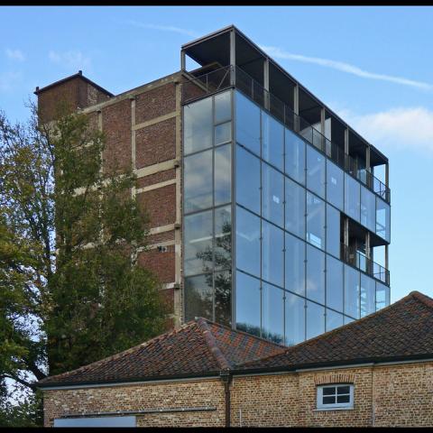 The old Tack brewery tower was transformed into a production house for performing arts. The tower has since developed to become one of the largest workspaces in Flanders for contemporary performance art.By packing part of it in glass, the character of the tower has been saved, but you can still see the old part. The Buda Tower has six studios for theatre and dance. I think this is a great form of repurposing because the building is now used for creative purposes.